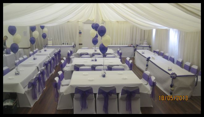 Hall decoraeted and tented for a wedding.